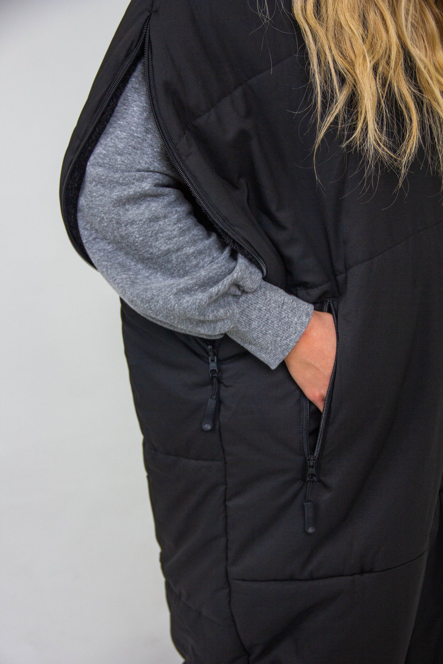 Sports mom wearable sleeping bag with multiple zippers for cold weather